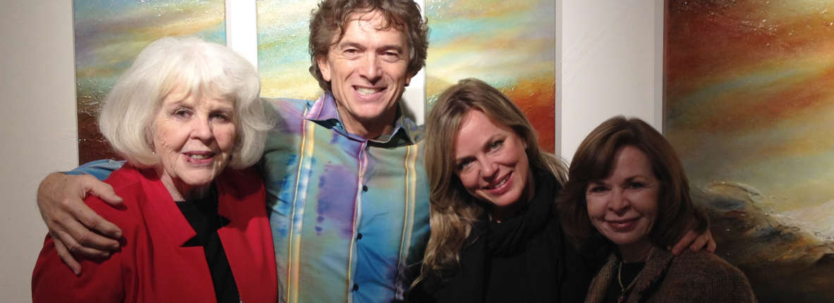 Michael Monroe Ethridge posing with Pippin and staff during his opening at Pippin Contemporary