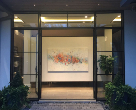 "Celebrate Life" by Aleta Pippin graces the entrance of these collectors' Dallas home